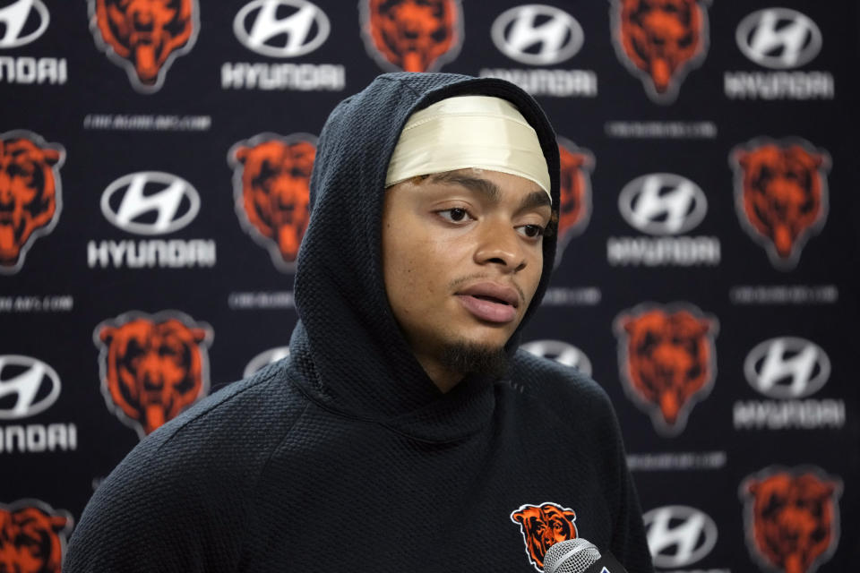 Chicago Bears quarterback Justin Fields addresses the media after an NFL football game against the Detroit Lions, Sunday, Nov. 19, 2023, in Detroit. (AP Photo/Paul Sancya)