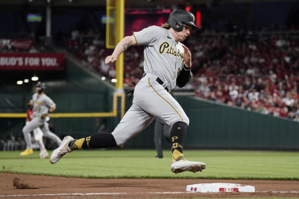 Pittsburgh Pirates' Jack Suwinski rounds third base before scoring on a single by Alfonso Rivas against the Cincinnati Reds during the fourth inning of a baseball game Saturday, Sept. 23, 2023, in Cincinnati. (AP Photo/Joshua A. Bickel)