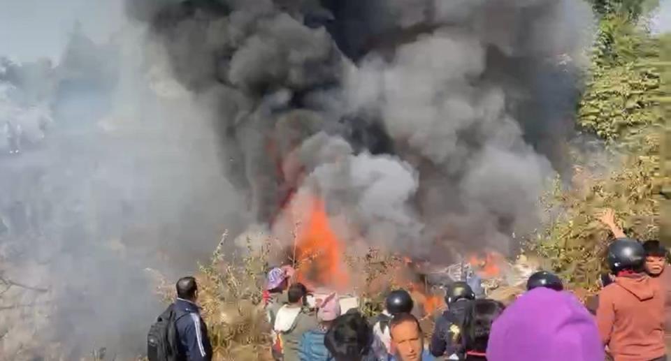 A screengrab taken from a video purportedly of the incident shows part of the aircraft on fire (Anadolu Agency via Getty)