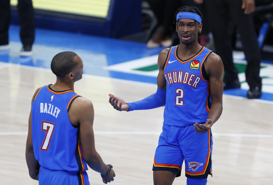 Feb 22, 2021; Oklahoma City, Oklahoma, USA; Oklahoma City Thunder guard Shai Gilgeous-Alexander (2) and forward Darius Bazley (7) react after a play against the Miami Heat during the second half at Chesapeake Energy Arena. Miami won 108-94. Mandatory Credit: Alonzo Adams-USA TODAY Sports