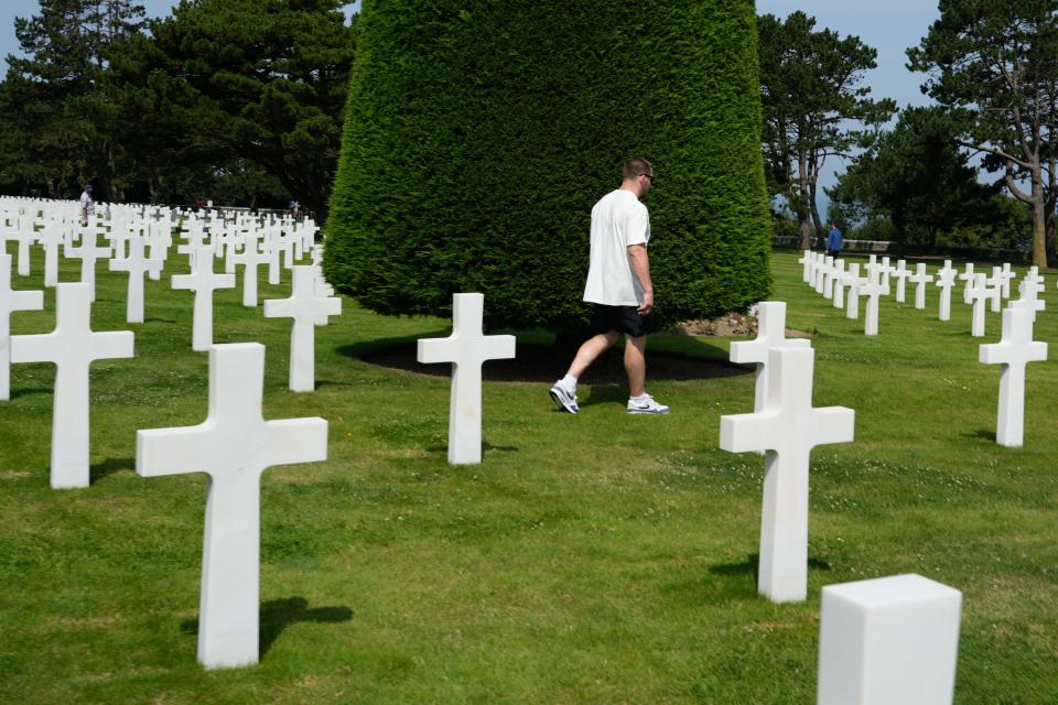 U.S. Olympic wrestler Mason Parris walks through the Normandy American Cemetery in Normandy, France.