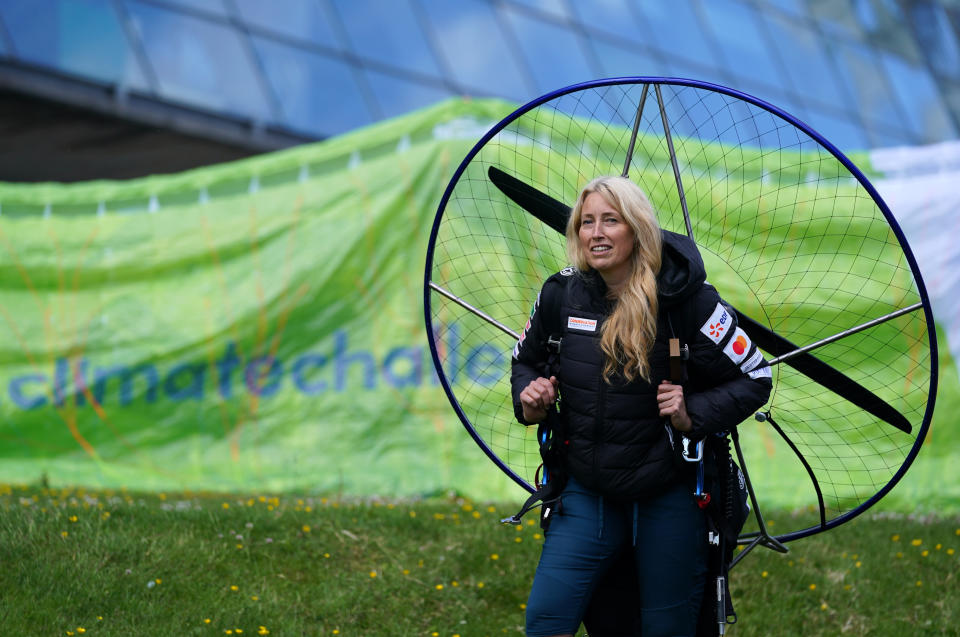 <p>Paramotorist Sacha Dench with her adapted electric paramotor at Glasgow Science Centre. Sacha, who is known as the 'Human Swan', will circumnavigate Britain in the adapted electric paramotor, flying anti-clockwise around the coast and returning to land in Glasgow around six weeks later, to mark the Cop26 climate conference being held in Glasgow. Picture date: Friday June 18, 2021.</p>
