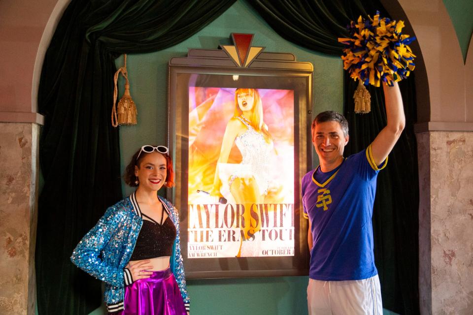 Sadie Kiel, 17, and her dad Daniel Kiel pose for a photo in front of the poster for “Taylor Swift: The Eras Tour” before going in to see the movie at Malco Paradiso Cinema Grill and IMAX in Memphis, Tenn., on Saturday, October 14, 2023. Kiel and her father saw the tour together in Chicago.