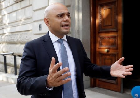 Britain's new Chancellor Sajid Javid speaks to the media as he arrives at the treasury in London