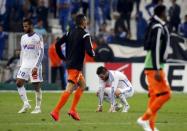 Olympique Marseille's Andre-Pierre Gignac (2nd R) and Jacques Alaixys Romao (L) react at the end of their French Ligue 1 soccer match against Lorient at the Velodrome stadium in Marseille, France April 24, 2015. REUTERS/Jean-Paul Pelissier