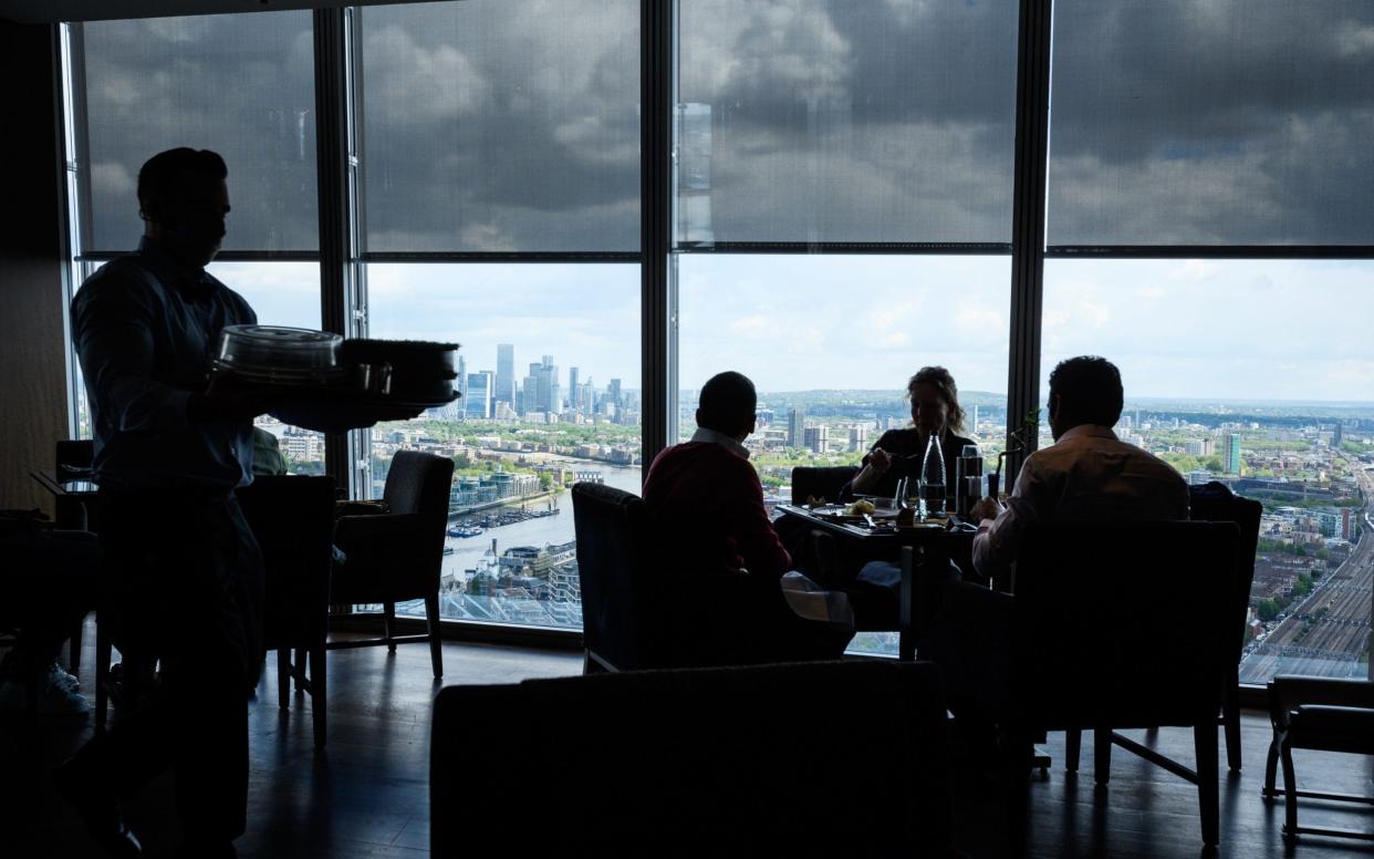 People enjoy a meal indoors at the Shard in London after the Government eased Covid restrictions further on May 17 - Leon Neal/Getty Images Europe