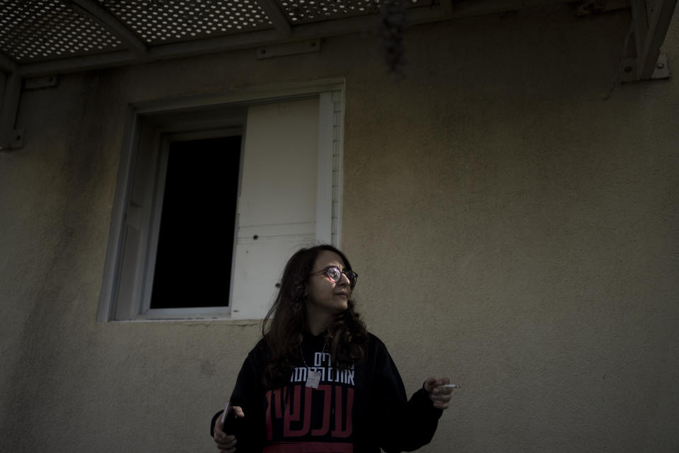 Sharon Alony Cunio stands outside of a safe room in the ruins of her home in Kibbutz Nir Oz on Monday, Jan.15, 2024.Cunio and her family had barricaded themselves in the room on Oct. 7, 2023, before Hamas militants seized them and dragged them to Gaza. Cunio and her daughters were released in November, but her husband remains in captivity in Gaza. (AP Photo/Maya Alleruzzo)
