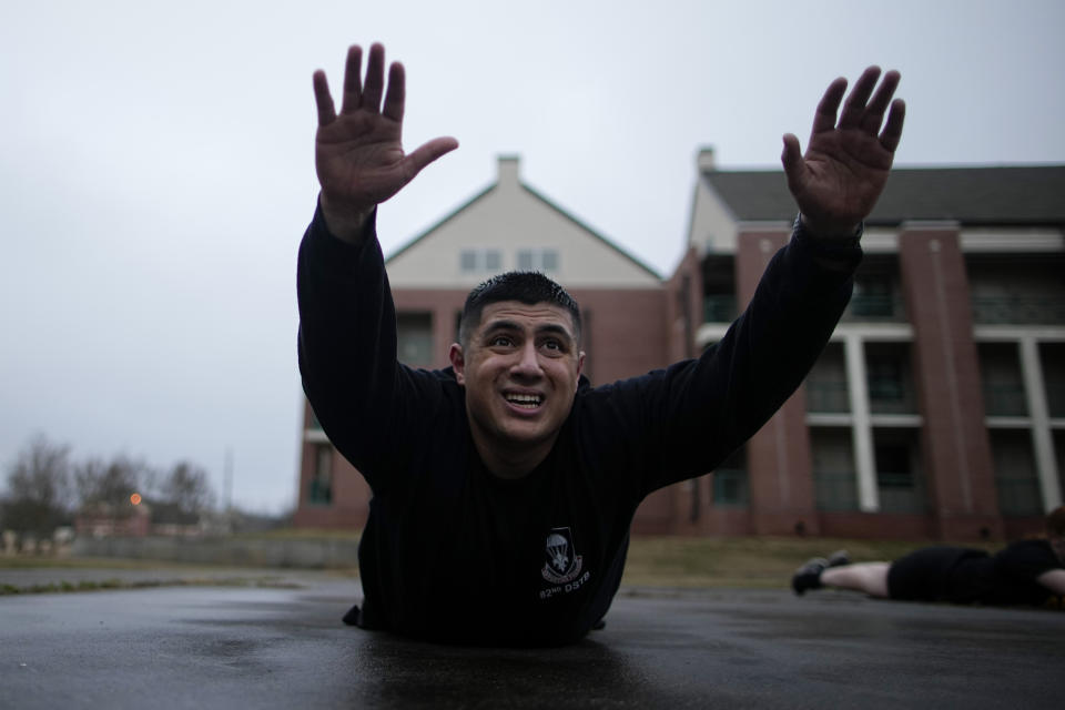 Army Staff Sgt. Daniel Murillo conducts physical training at Ft. Bragg on Wednesday, Jan. 18, 2023, in Fayetteville, N.C. After gaining 30 pounds during the COVID-19 pandemic, Murillo is finally getting back into fighting shape. Early pandemic lockdowns, endless hours on his laptop and heightened stress led Murillo, 27, to reach for cookies and chips in the barracks at Fort Bragg. (AP Photo/Chris Carlson)