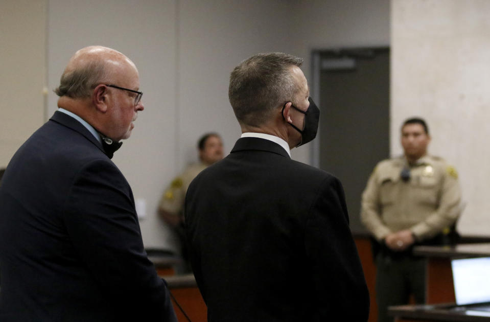 Paul Flores, right, listens after a jury found him guilty of murdering Cal Poly student Kristin Smart in Monterey County Superior Court on Tuesday, Oct. 18, 2022, in Salinas, Calif. Jurors unanimously found Flores guilty of first-degree murder. (Laura Dickinson/The Tribune via AP, Pool)