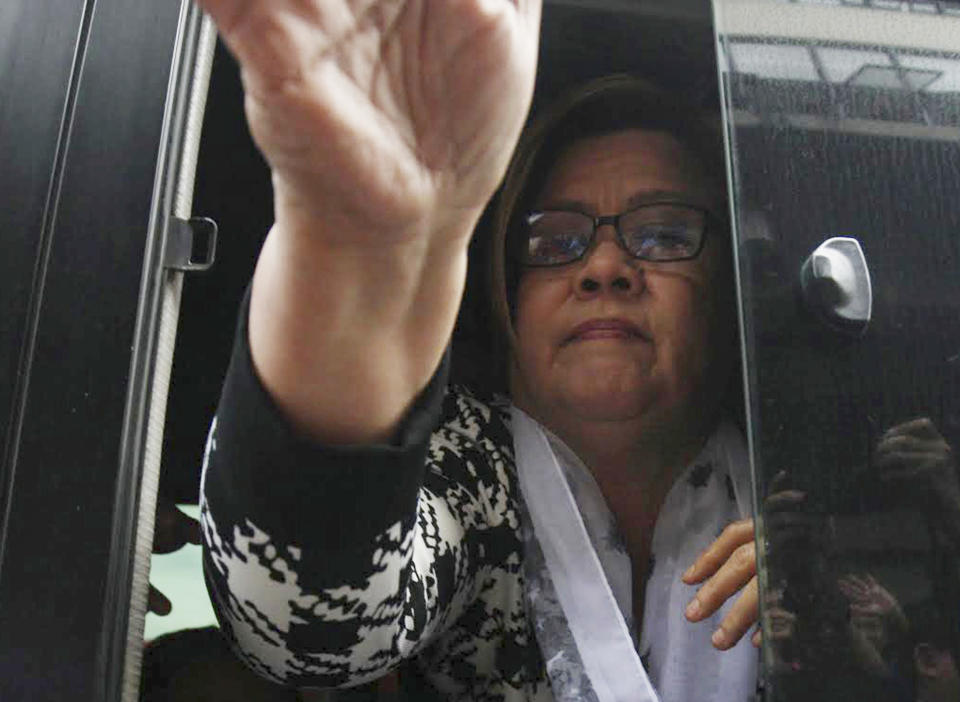 Philippine Senator Leila de Lima arrives at a regional trial court for a brief personal appearance following her arrest on drug charges Friday, Feb. 24, 2017, in suburban Paranaque city, southeast of Manila, Philippines. De Lima was arrested Friday on drug charges but professed her innocence and vowed she would not be intimidated by a leader she called a "serial killer." (AP Photo)