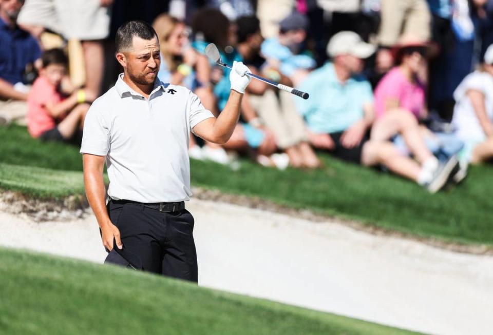 Xander Schauffele gets ready to hit from.a bunker on the 15th hole during round three of the Wells Fargo Championship at Quail Hollow Club in Charlotte, N.C., on Saturday, May 11, 2024.