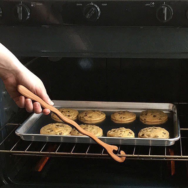 You have to make sure those cookies aren't raw in the middle. This oven rack pull will come in handy when their bakes are too hot to handle. <a href="https://fave.co/350erN7" target="_blank" rel="noopener noreferrer">Find it for $20 at Uncommon Goods</a>.