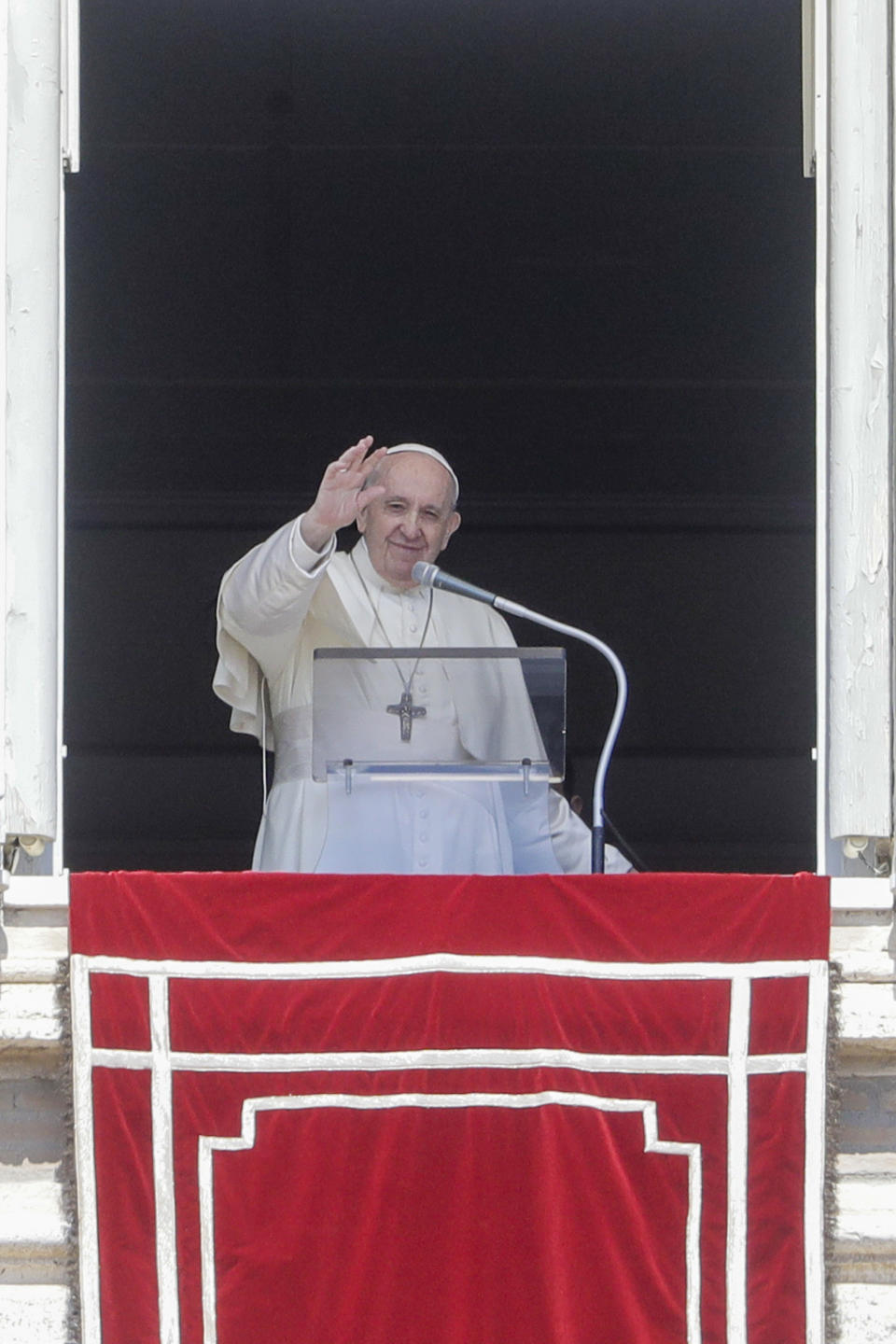 Pope Francis delivers his blessing as he recites the Regina Coeli noon prayer from the window of his studio overlooking St.Peter's Square, at the Vatican, Sunday, April 25, 2021. (AP Photo/Andrew Medichini)