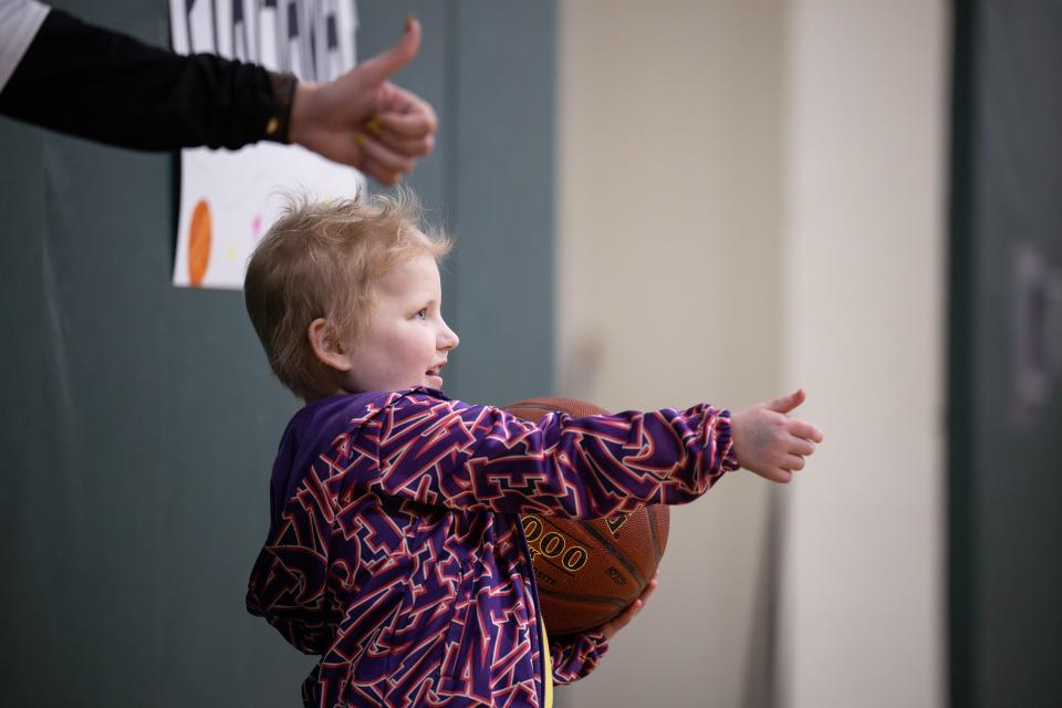 Ava Blazis, a Sutton native with acute lymphoblastic leukemia, gives a thumbs-up during a benefit game between Sutton and Notre Dame Academy.