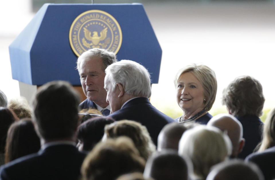 George W. Bush and Hillary Clinton file in