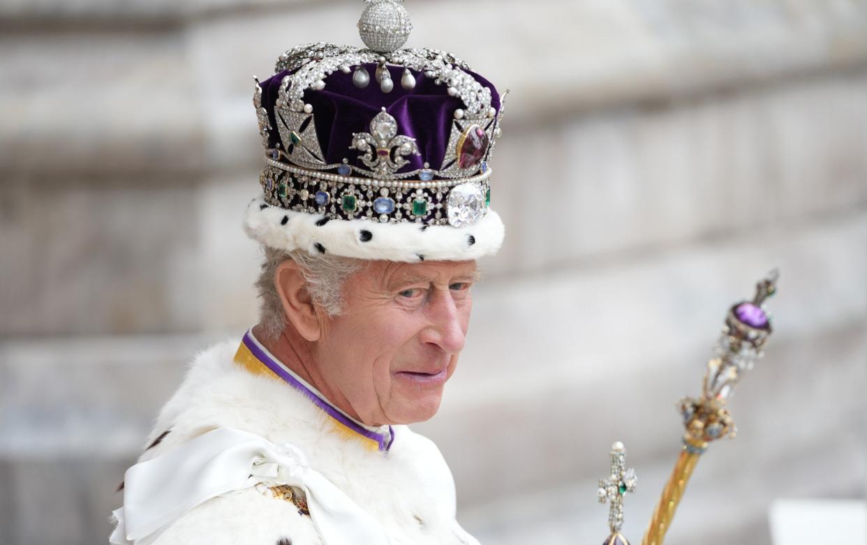 King Charles III leaves Westminster Abbey after his Coronation on May 6, 2023