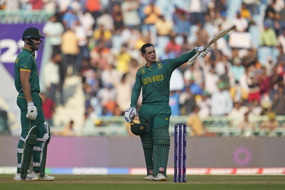South Africa's Quinton De Kock celebrates after scoring a century during the ICC Cricket World Cup match between Australia and South Africa in Lucknow, India, Thursday, Oct. 12, 2023. (AP Photo/Altaf Qadri )