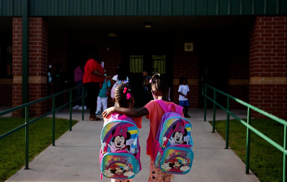 A Bond Elementary School student consoles another during the first day of school on Wednesday, Aug. 10, 2022 in Tallahassee, Fla. 