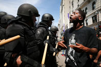 <p>Protesters face off with riot police escorting conservative activists following a march in Boston against a planned ‘Free Speech Rally’ just one week after the violent ‘Unite the Right’ rally in Virginia left one woman dead and dozens more injured on August 19, 2017 in Boston, Mass. (Photo: Spencer Platt/Getty Images) </p>