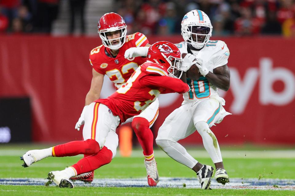 Nov 5, 2023; Frankfurt, Germany, ; Miami Dolphins wide receiver Tyreek Hill (10) catches a pass defended by Kansas City Chiefs cornerback L'Jarius Sneed (38) in the first quarter during an NFL International Series game at Deutsche Bank Park. Mandatory Credit: Nathan Ray Seebeck-USA TODAY Sports