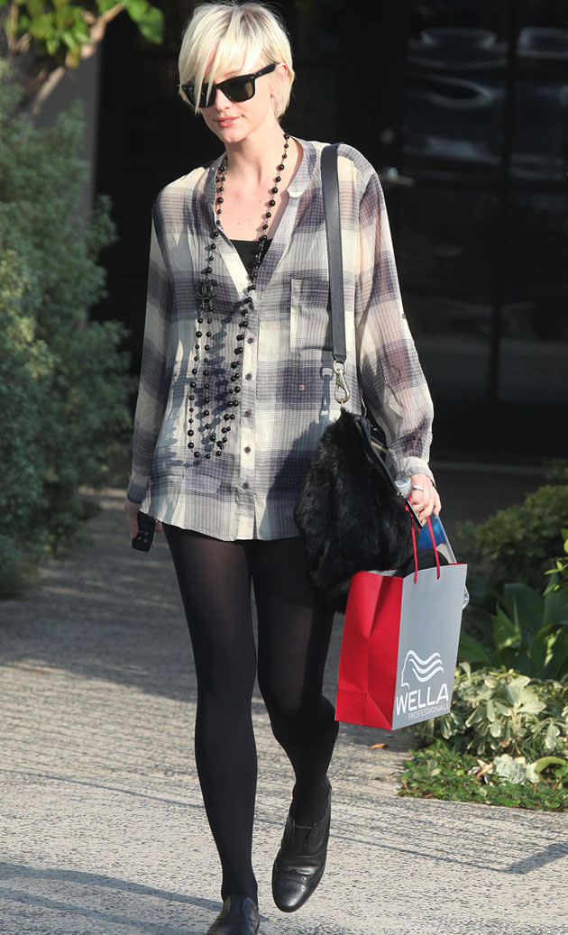 Ashlee Simpson went for an oversized grey tartan shirt