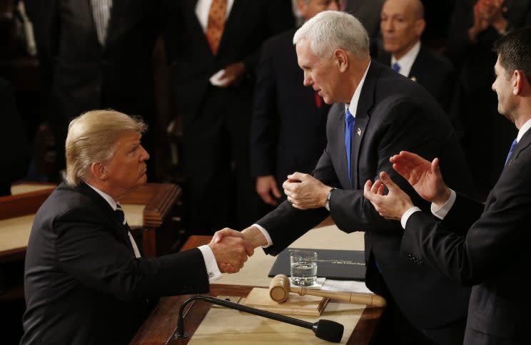 President Trump shakes hands with Vice President Mike Pence after addressing Congress on Tuesday. (Photo: Reuters)