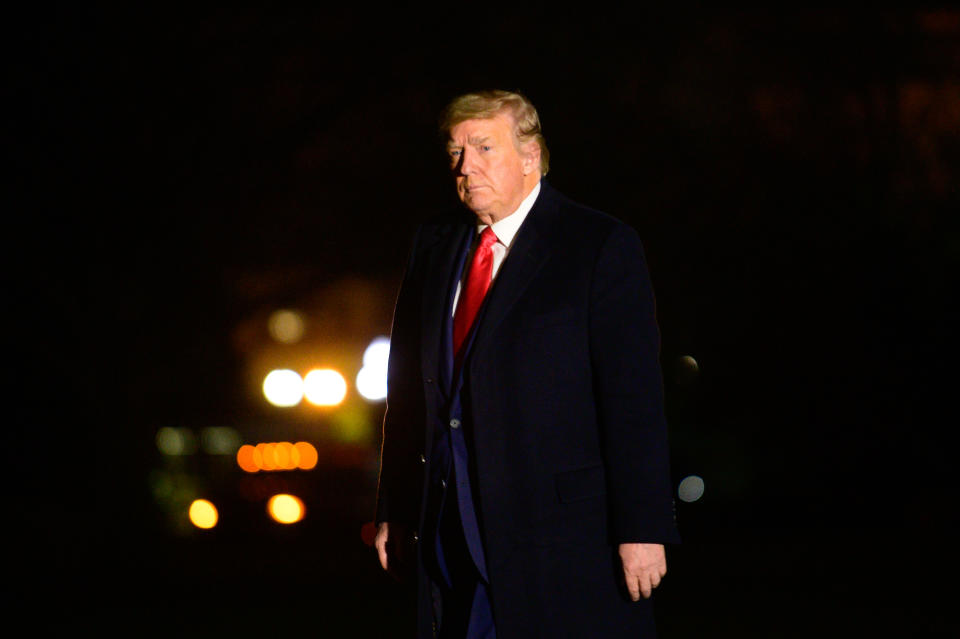 President Trump walks on the South Lawn of the White House on Tuesday after returning from a rally in Georgia. (Erin Scott/Bloomberg via Getty Images)