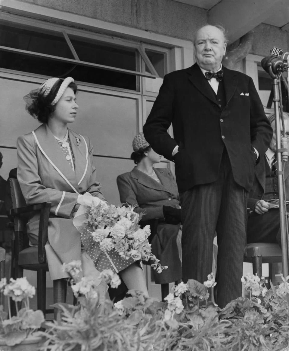 Winston Churchill and the Queen at the opening of the International Youth Centre at Chigwell, Essex, 12 July 1951 (Getty)