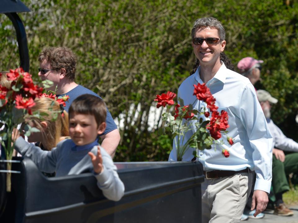 Town Administrator Peter Lombardi walks with other town employees along the parade route during 2022's Brewster in Bloom Town Parade.