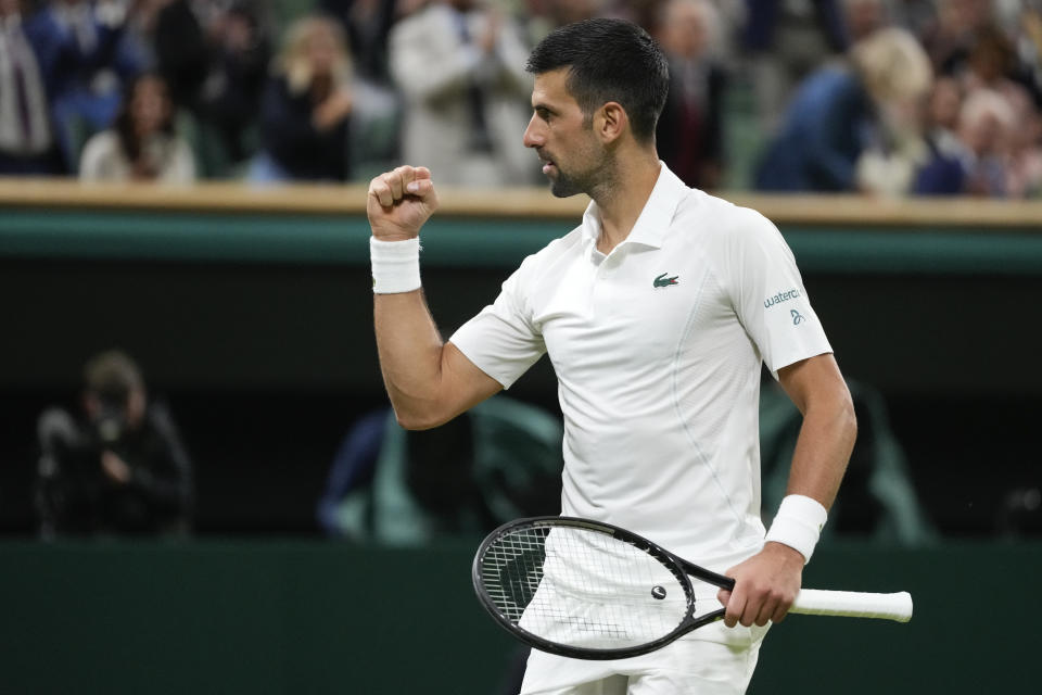 Novak Djokovic of Serbia celebrates after defeating Holger Rune of Denmark in their fourth round match at the Wimbledon tennis championships in London, Monday, July 8, 2024. (AP Photo/Kirsty Wigglesworth)