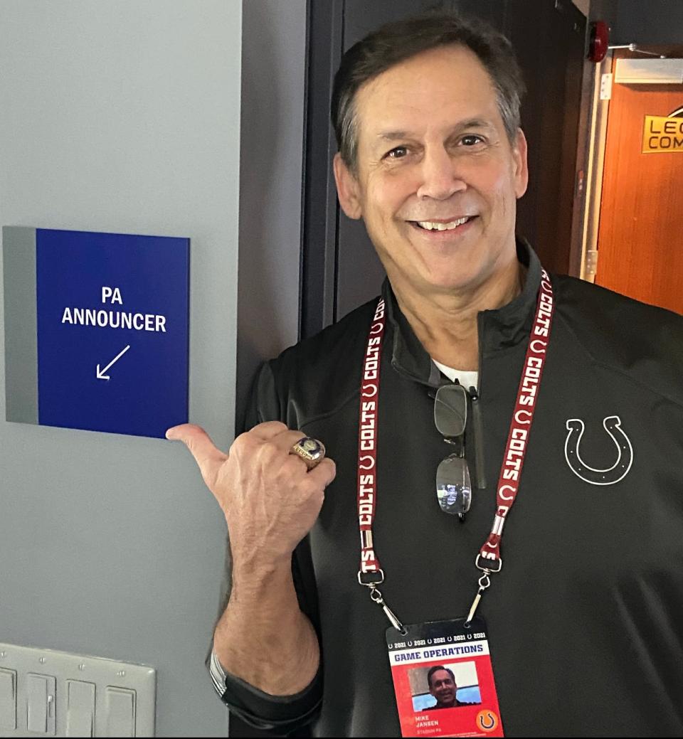 Mike Jansen stands next to his "PA Announcer" sign during his tenure as the stadium voice of the Indianapolis Colts.