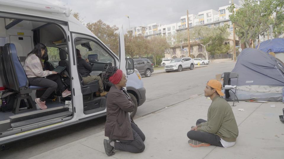 Jessica Jimenez chats with an unhoused patient in West Hollywood