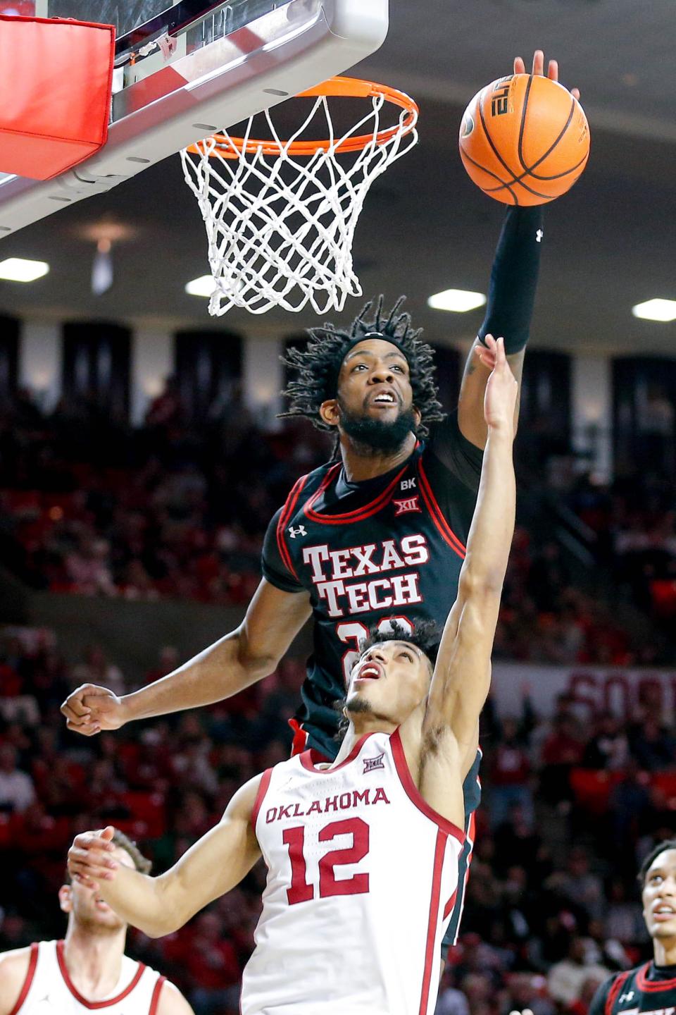 Texas Tech forward Warren Washington (22) bats down a layup attempt by Oklahoma guard Milos Uzan (12) in the second half during an NCAA basketball game between University of Oklahoma (OU) and Texas Tech at the Lloyd Noble Center in Norman, Okla., on Saturday, Jan. 27, 2024.