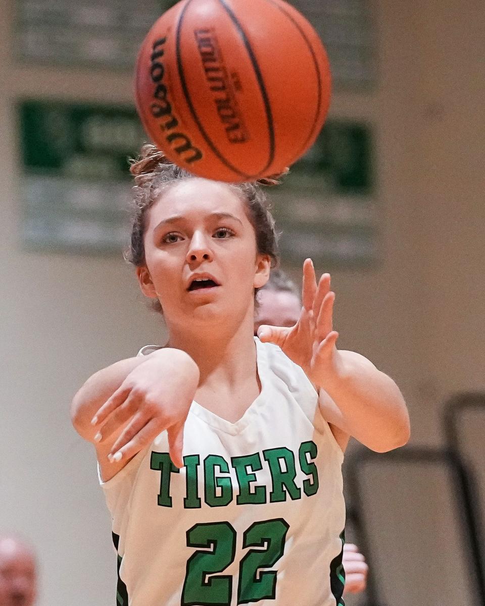 Triton Central Tigers Maryrose Felling (22) passes the ball Tuesday, Jan. 31, 2023 at Triton Central High School in Fairland. The Eastern Hancock Royals defeated the Triton Central Tigers, 49-44. 