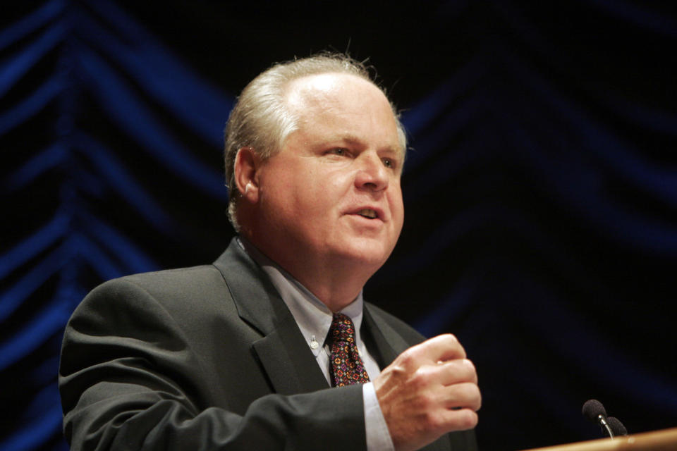 Radio show host Rush Limbaugh speaks at a forum hosted by the Heritage Foundation, on the similarities between the war on terrorism and the television show "24," in Washington June 23, 2006. REUTERS/Micah Walter (UNITED STATES)