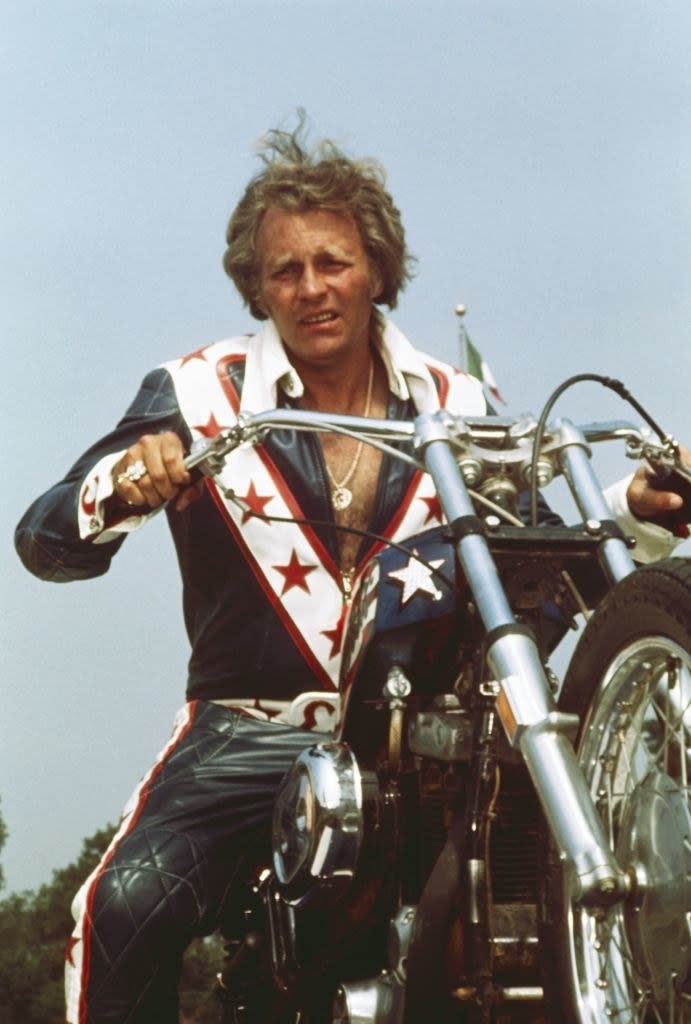 Evel Knievel poses on his motorcycle