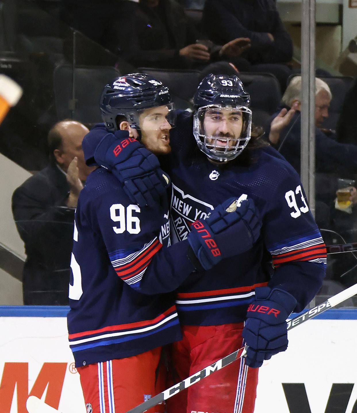 NEW YORK, NEW YORK - MARCH 17: Mika Zibanejad #93 of the New York Rangers (R) celebrates his second period goal against the New York Islanders along with Jack Roslovic #96 at Madison Square Garden on March 17, 2024 in New York City.
