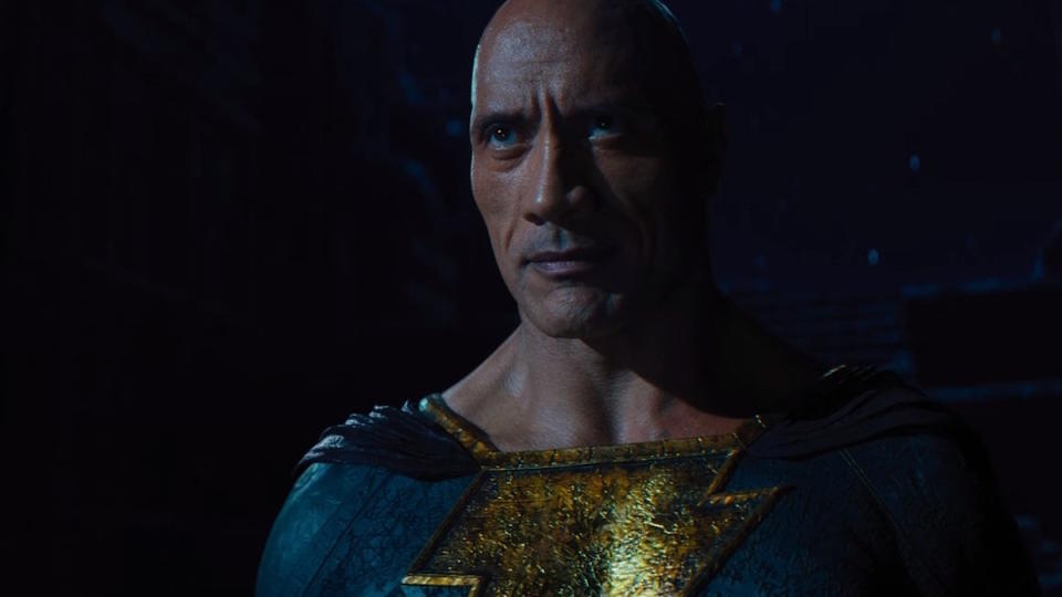 Black Adam stands in the dark, staring at Superman in Black Adam