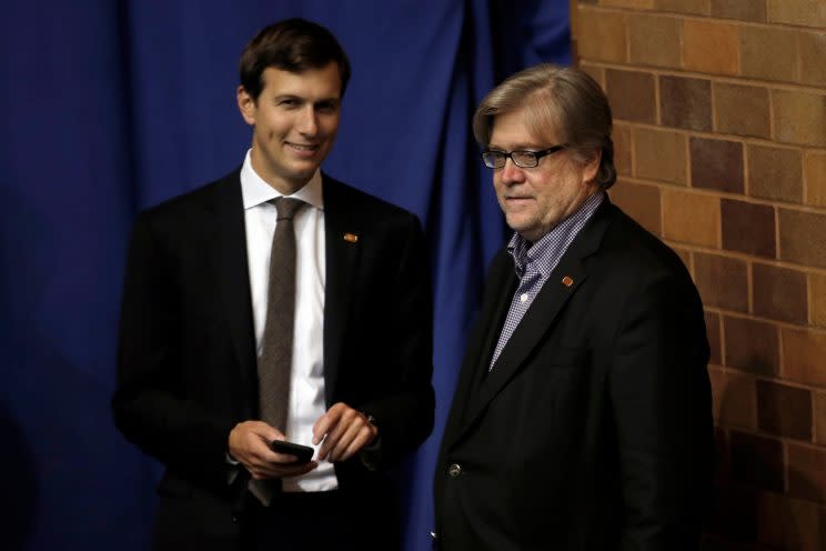 Jared Kushner and Stephen Bannon watch Donald Trump hold a campaign rally in Canton, Ohio, in September. (Mike Segar/Reuters)