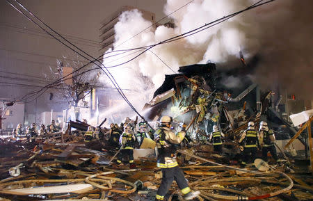 Firefighters operate at the site where a large explosion occurred at a restaurant in Sapporo, Hokkaido, northern Japan, in this photo taken by Kyodo December 16, 2018. Mandatory credit Kyodo/via REUTERS