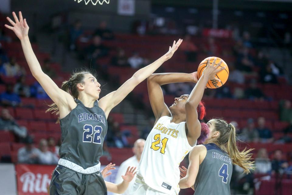 Sand Springs' Layne Kirkendoll attempts a shot over Edmond North's Toni Papahronis during a Class 6A semifinal Friday at Lloyd Noble Center in Norman.