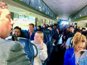  Jeff Spiehs, who specializes in urban planning with Lamp Rynearson engineering firm, guides a bus tour of some North Omaha transformed lots. (Cindy Gonzalez/Nebraska Examiner)