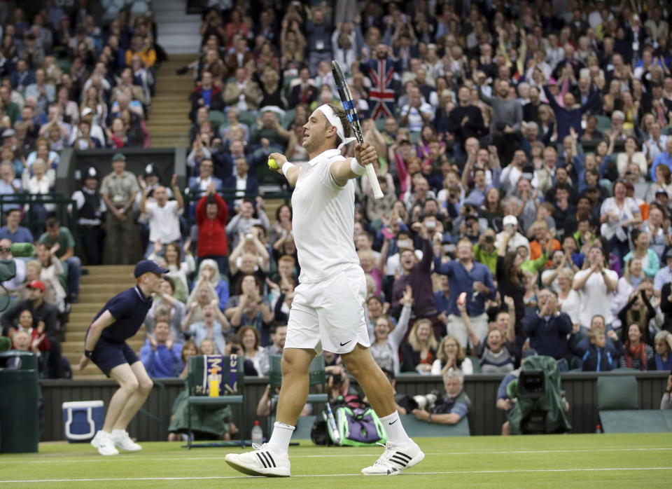 FILE - Marcus Willis, of Britain, celebrates after winning a point against Roger Federer of Switzerland during their men's singles match on day three of the Wimbledon Tennis Championships in London, in this Wednesday, June 29, 2016, file photo. Willis, the Everyman’s everyman who was ranked 772nd when he faced Roger Federer at Wimbledon in 2016, is ending his playing career and focusing on coaching tennis to try to show youngsters “that anyone can live the dream.”(AP Photo/Tim Ireland, File)