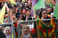 People shout slogans during a gathering to celebrate Newroz, which marks the arrival of spring and the new year, in Istanbul, Turkey March 21, 2018. REUTERS/Murad Sezer