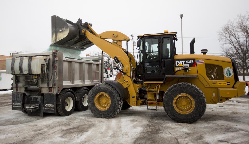 Road salt is loaded into a snow plow truck equipped with a salt spreader at the public works facility in Glen Ellyn, Ill., on Tuesday, Feb. 4, 2014. The Midwest's recent severe winter weather has caused communities to expend large amounts of their road salt supplies. (AP Photo/Andrew A. Nelles)