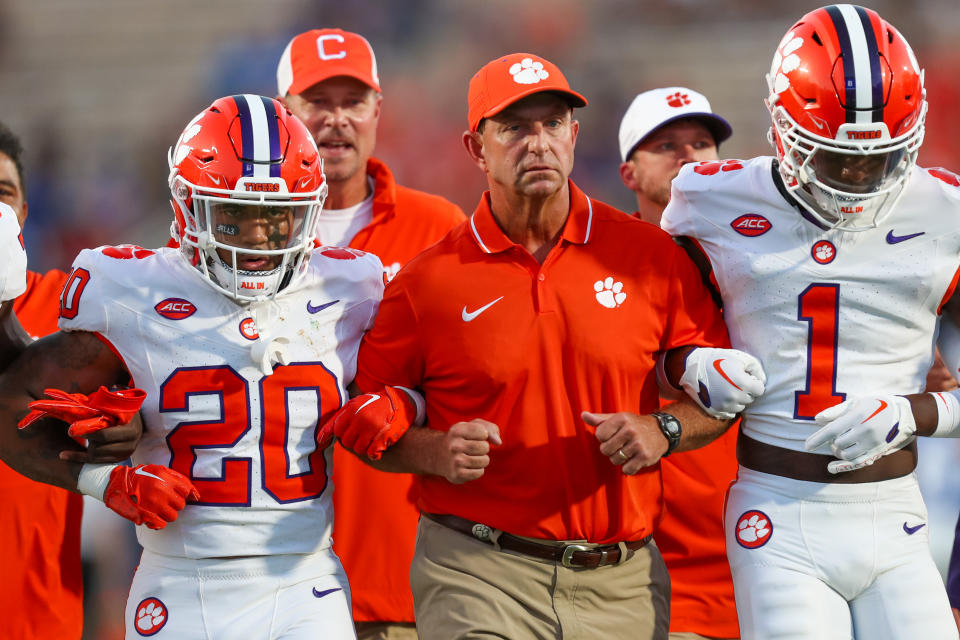 DURHAM, NC - SEPTEMBER 04:Head Coach Dabo Swinney of the Clemson Tigers walks arm in arm with his players before a football game against the Duke Blue Devils at Wallace Wade Stadium in Durham, North Carolina on Sep 4, 2023.  (Photo by David Jensen/Icon Sportswire via Getty Images)