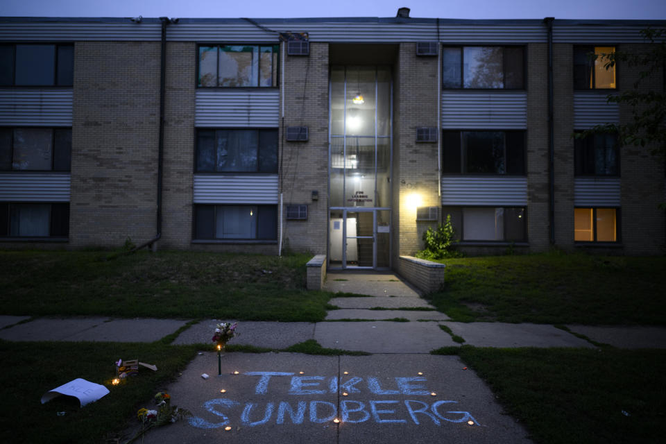 Tekle Sundberg's name is written in chalk during a vigil for 20-year old Sundberg Thursday, July 14, 2022 outside the apartment building where he was killed by Minneapolis Police in Minneapolis. Minneapolis police officers shot and killed Sundberg early Thursday after an overnight standoff that began after he allegedly fired shots inside an apartment building on the city's south side, according to city and state officials. (Aaron Lavinsky/Star Tribune via AP)