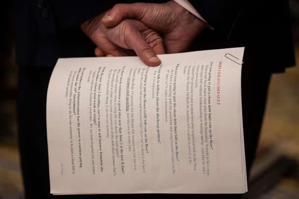 PHOTO: Senate Majority Leader Chuck Schumer (D-N.Y.) holds sheets of paper with talking points on debt ceiling legislation during a press conference on Capitol Hill, May 2, 2023. (Francis Chung/POLITICO via AP Images)