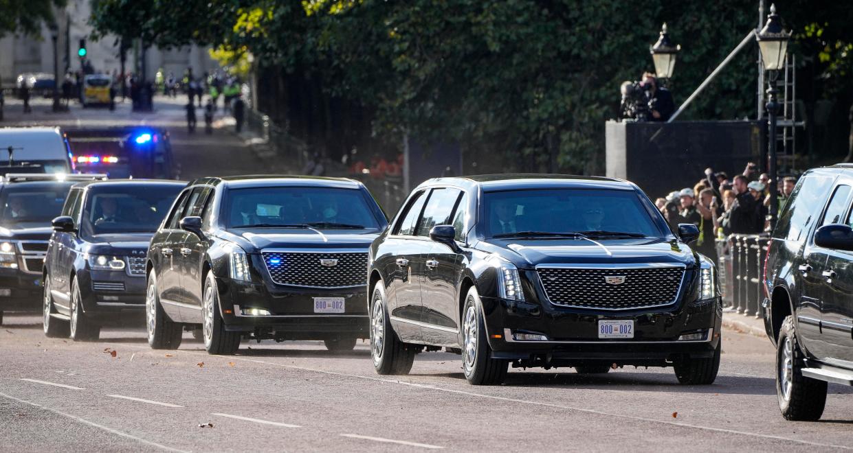 U.S President Joe Biden in a convoy passes in front of Buckingham Palace in London, England, Sunday, Sept. 18, 2022, to attend the funeral of Queen Elizabeth II on Monday. (AP Photo/Martin Meissner)