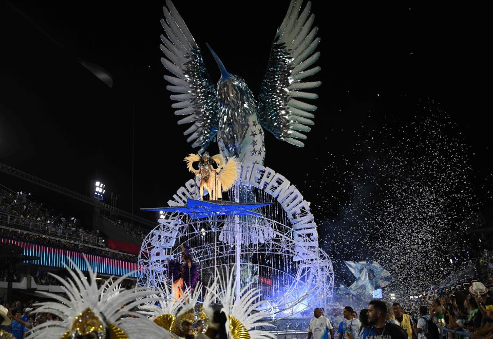A member of the Beija Flor samba school performs during the second night of Rio's Carnival parade at the Sambadrome Marques de Sapucai in Rio de Janeiro, Brazil on Feb. 21, 2023. - The world's biggest carnival hit peak party level as Rio's top samba schools on February 19 opened their annual parade competition in the giant avenue-turned-stadium known as the "Sambadrome."